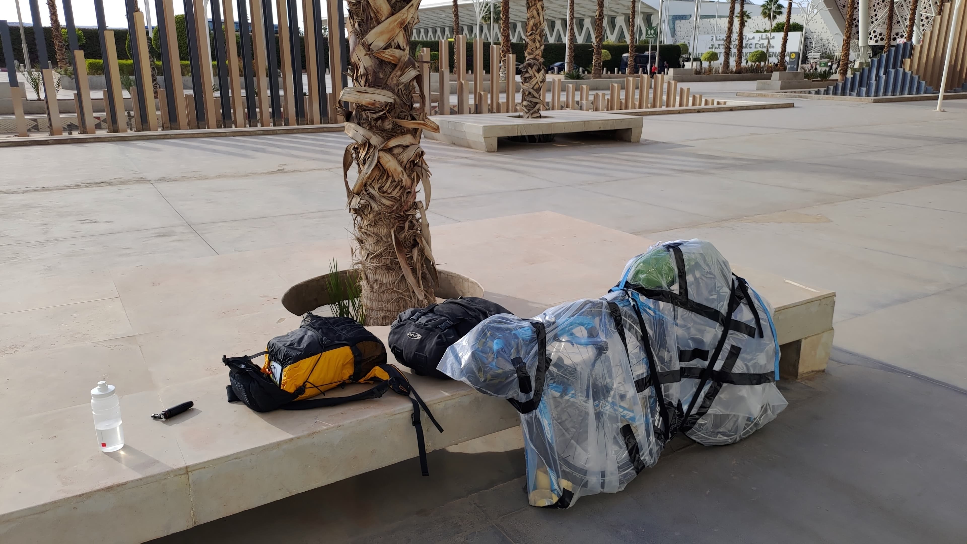 A large thick plastic bag tightly wrapped around my disassembled bicycle, held together with more duct tape than is reasonable, outside Marrakesh airport